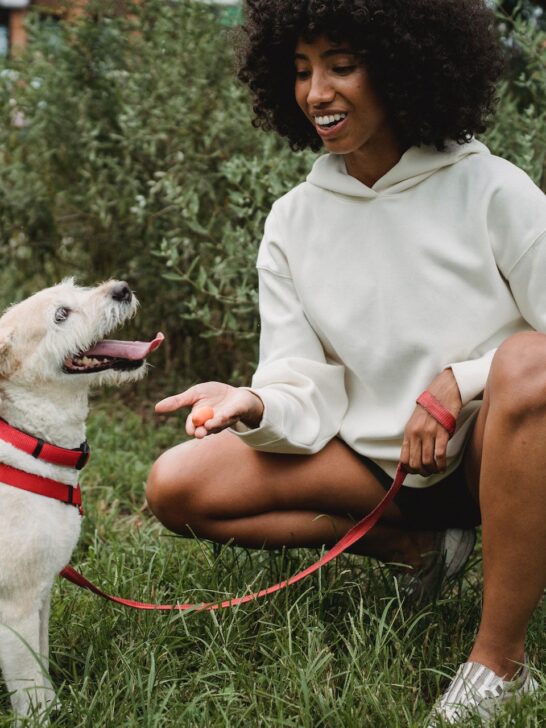 women feeding her dog