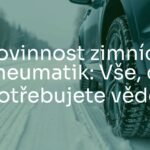 Winter tires on a car in snowy conditions, frosty road, realistic, safety-focused.